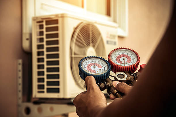 Professional Air Conditioning Service technician working in Springdale, PA